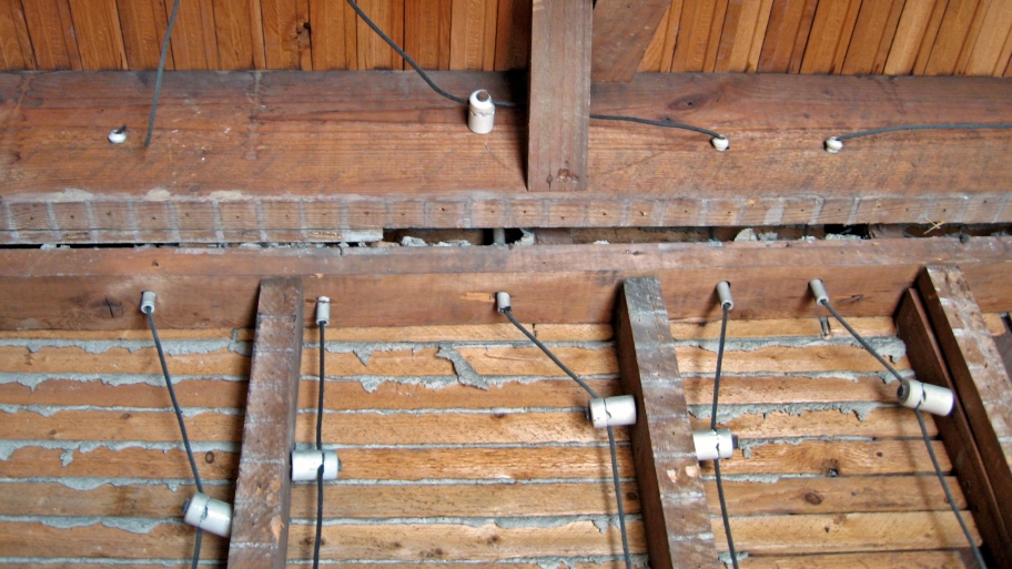 knob and tube electrical wiring on rafters in house
